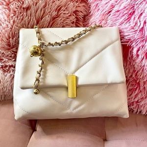 White quilted sling bag